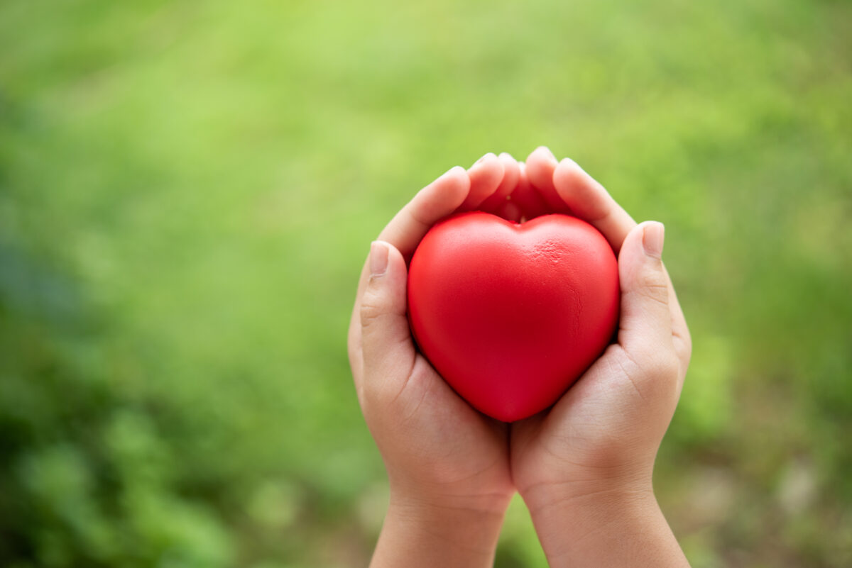 child-holding-red-rubber-heart-1200x801.jpg